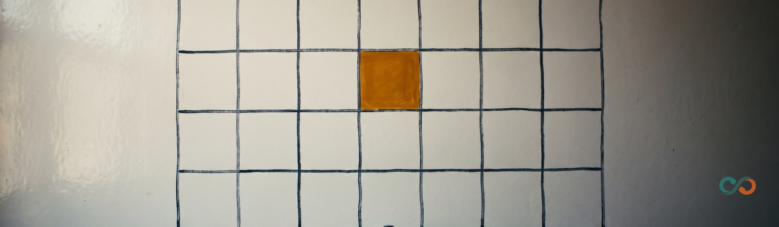 How to reduce no-shows: a wall calendar with one day marked in amber and a bell on a shelf
